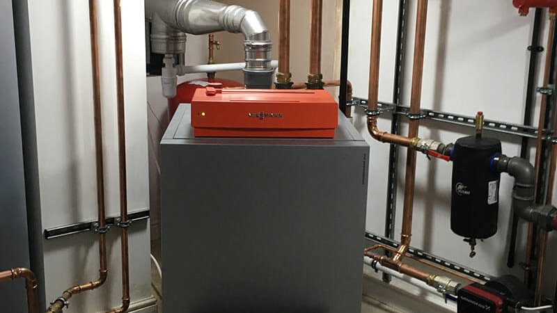 New Viessman oil fired boiler for 'off grid' house with flue running up existing chimney and variable speed pumps